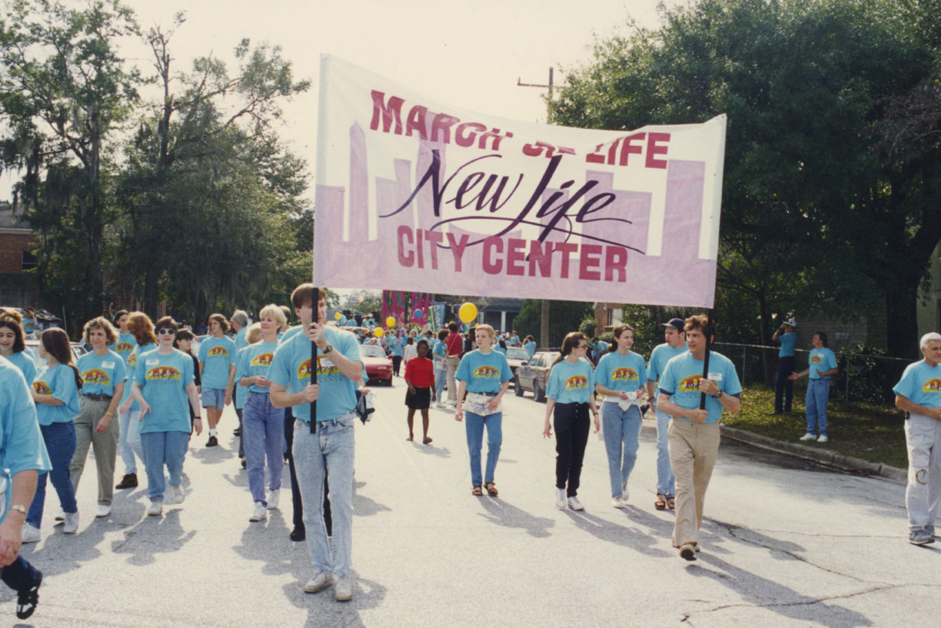 Church members marching in a parade 